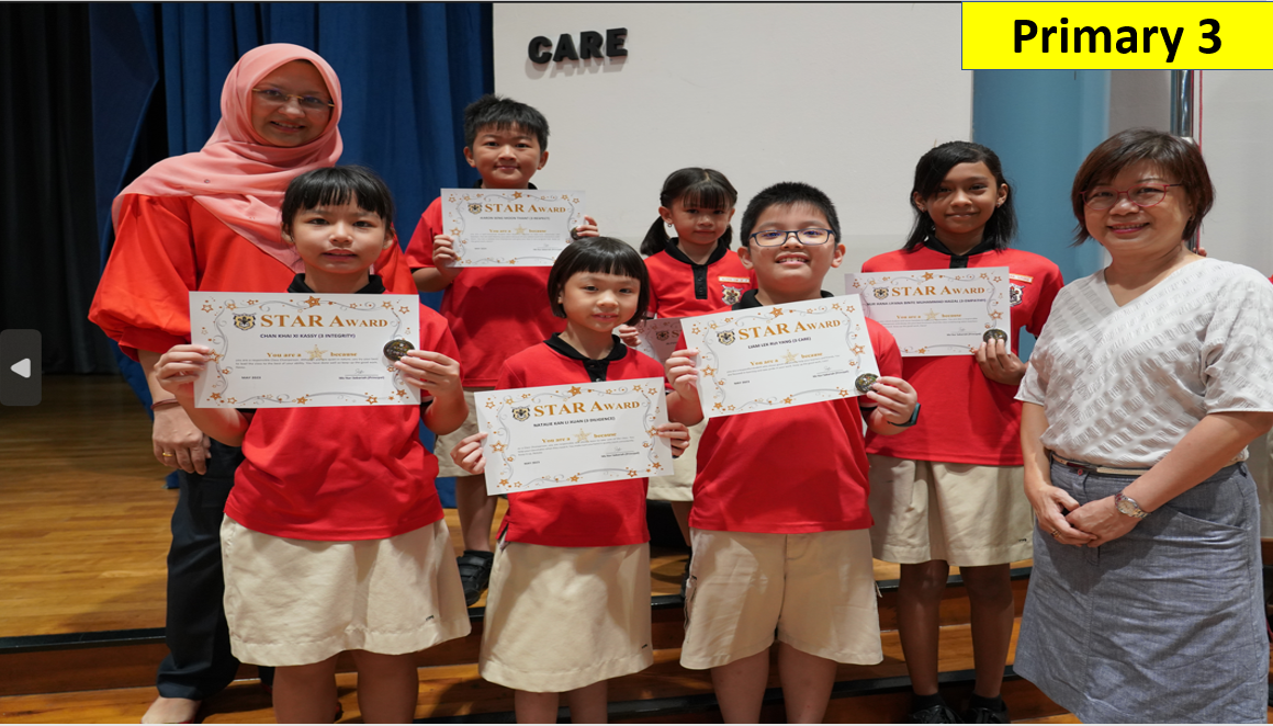 Five Primary 3 students in red uniforms hold Star Award certificates, flanked by two adult women teachers.